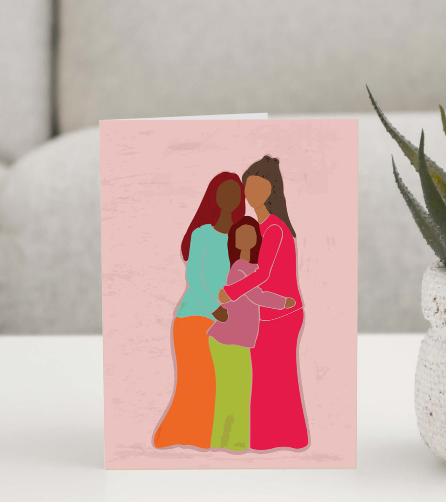 Beautiful greeting card featuring an illustration of three women embracing in a warm and loving hug, symbolizing sisterhood, family, and deep bonds. 