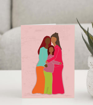 Beautiful greeting card featuring an illustration of three women embracing in a warm and loving hug, symbolizing sisterhood, family, and deep bonds. 