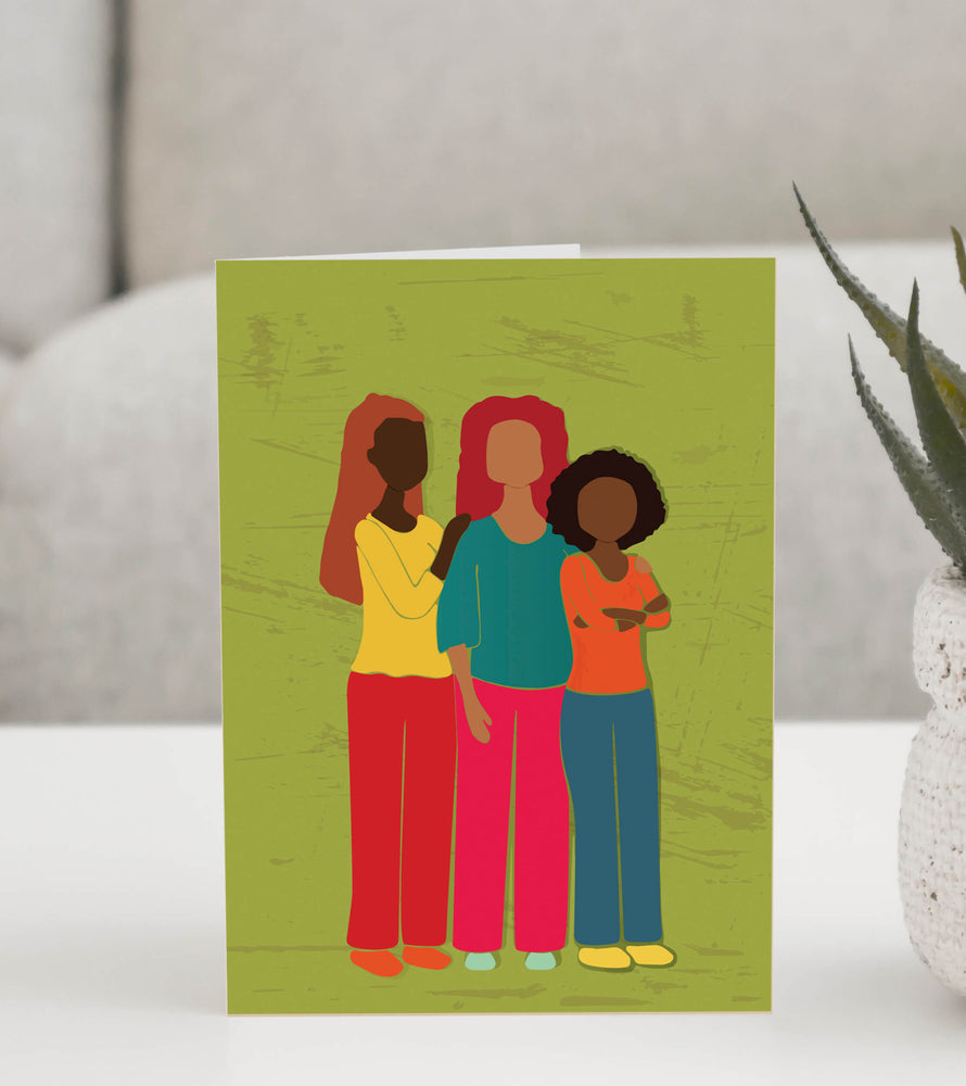 Illustrated greeting card featuring three women standing together in unity, symbolizing strength, sisterhood, and empowerment. 